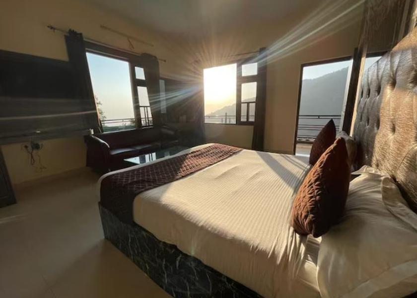 Himachal Pradesh Dharamshala King Room attached balcony and lounge set in the room