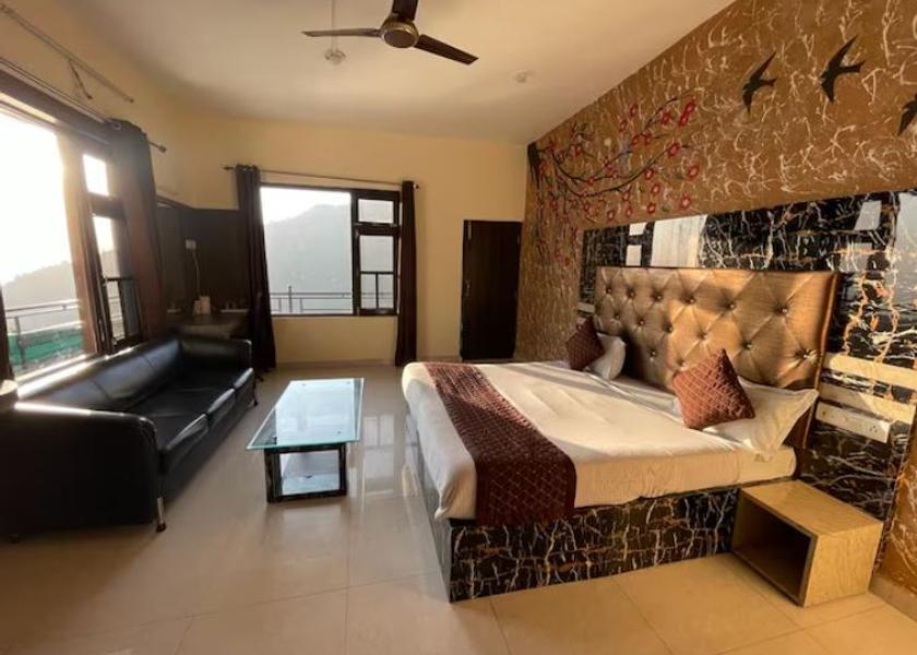 Himachal Pradesh Dharamshala King Room attached balcony and lounge set in the room