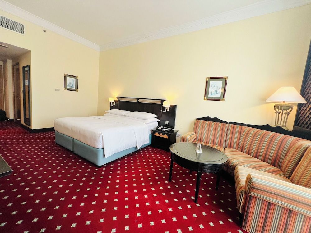 Millennium Airport Hotel Dubai Grand Room, complimentary shuttle to DXB Airport Terminal 1 & 3