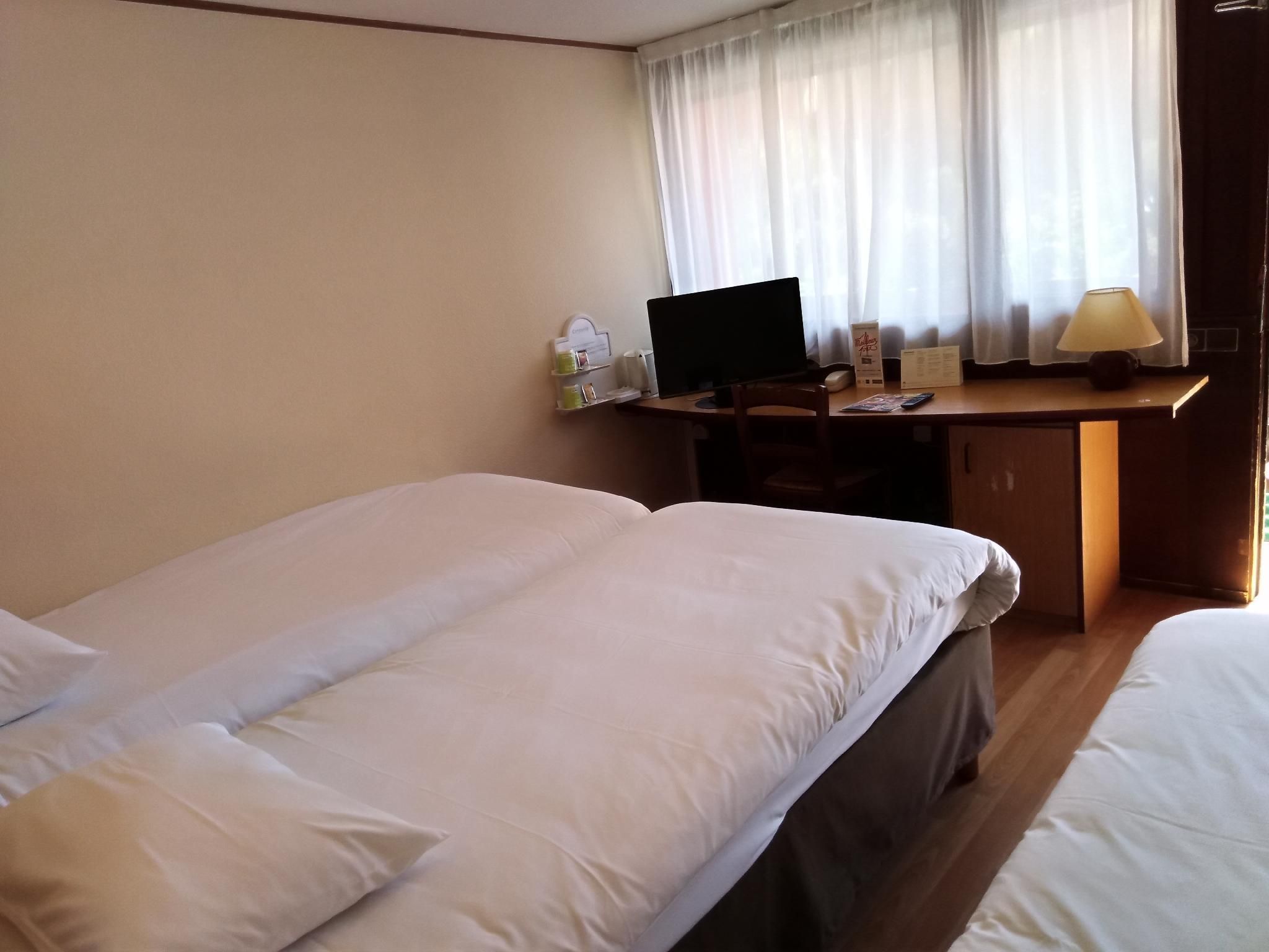 Triple - 2 Single Beds + 1 Extra Bed