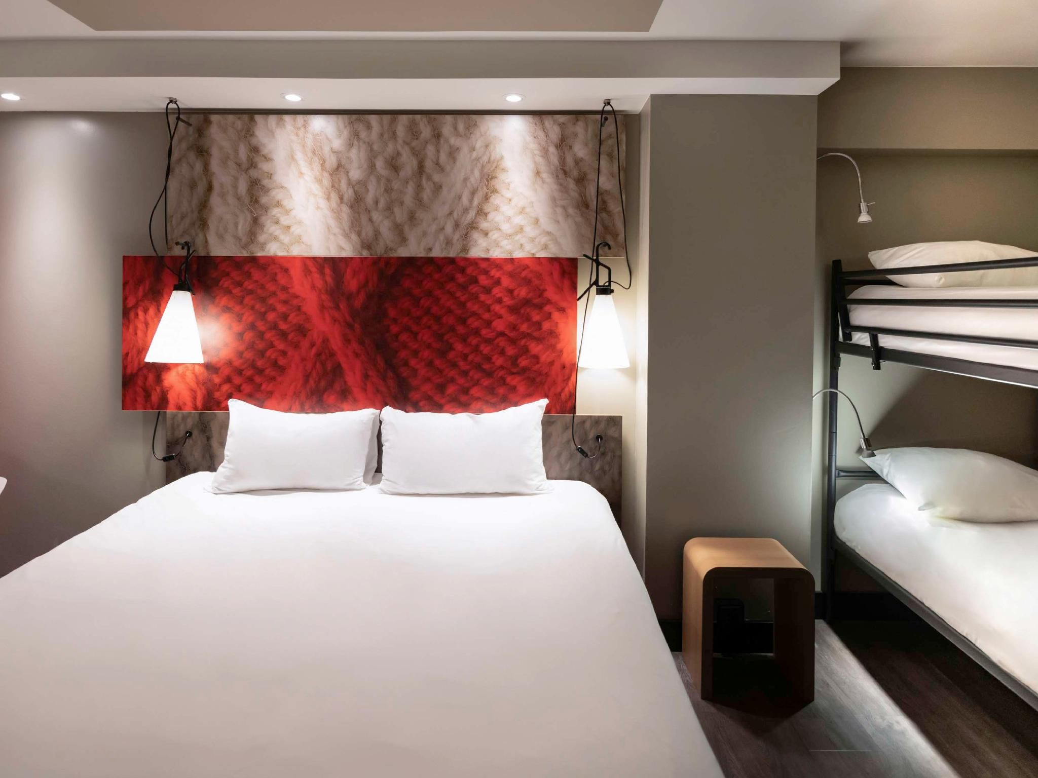 Family room with bunk beds and a view of the tr ains