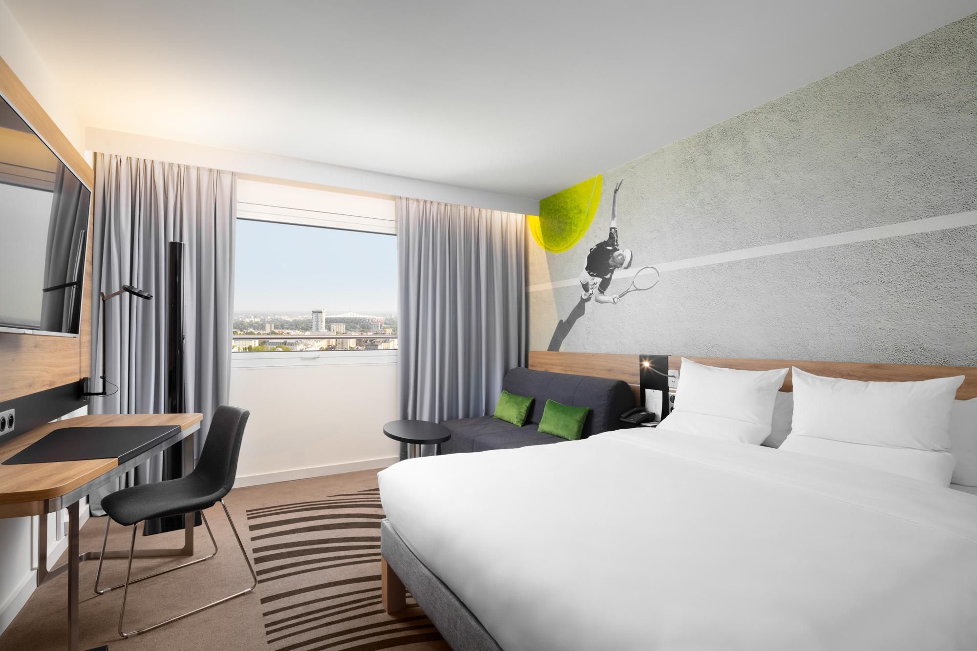 Superior Room with double bed and sofa