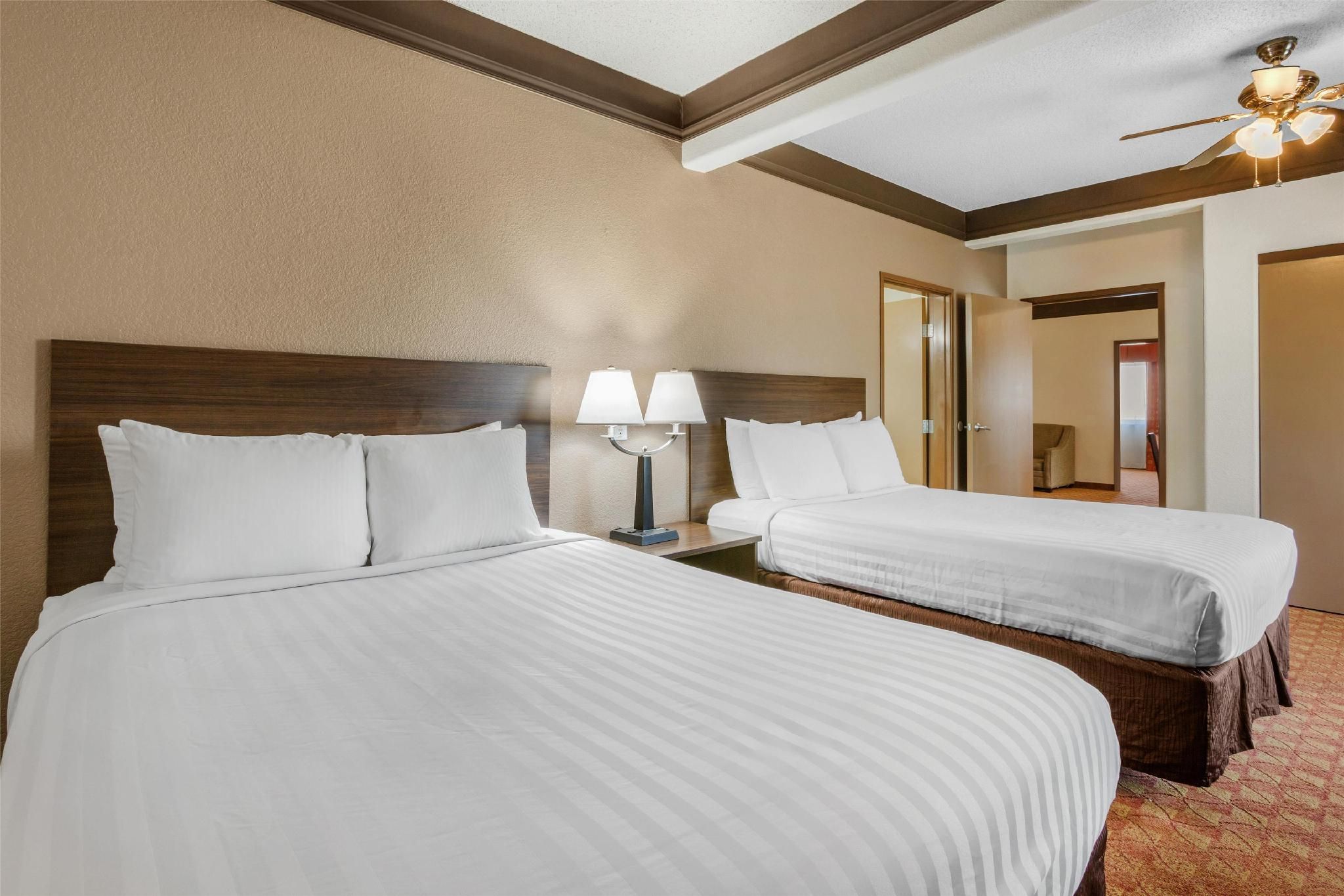 Suite - 1 King 2 Queen Beds, Non-Smoking, Two Rooms, Three Televisions, Microwave And Refrigerator,