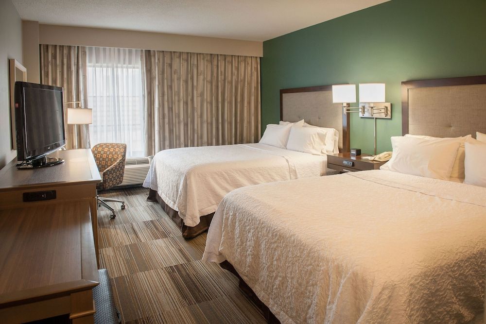 Two queen beds with sofa bed
