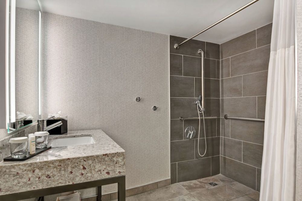 Suite, 1 King Bed, Accessible, Corner (Roll-In Shower)