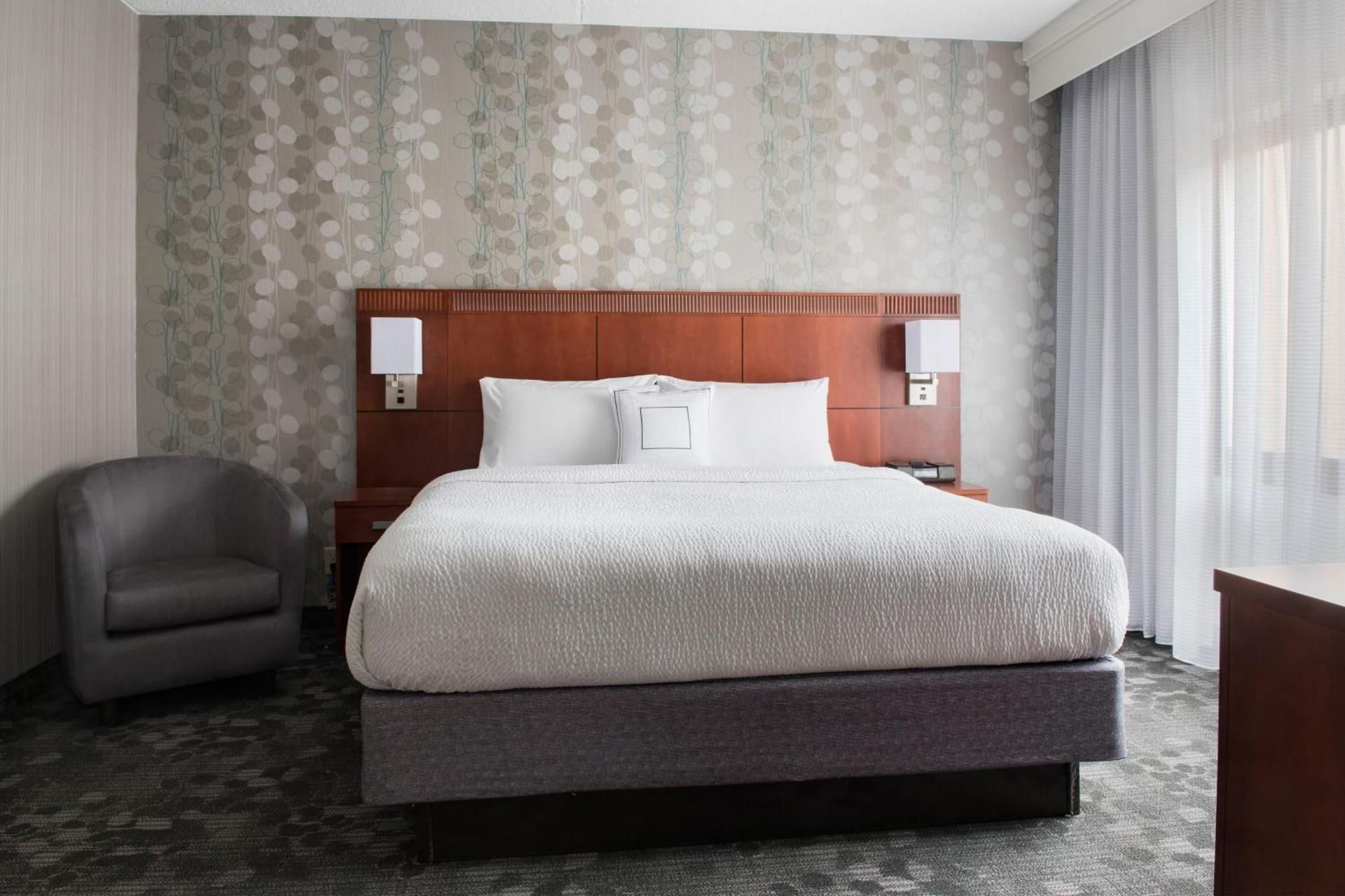 One-Bedroom King Suite with Sofa Bed, Courtyard View and Balcony  Hearing Accessible