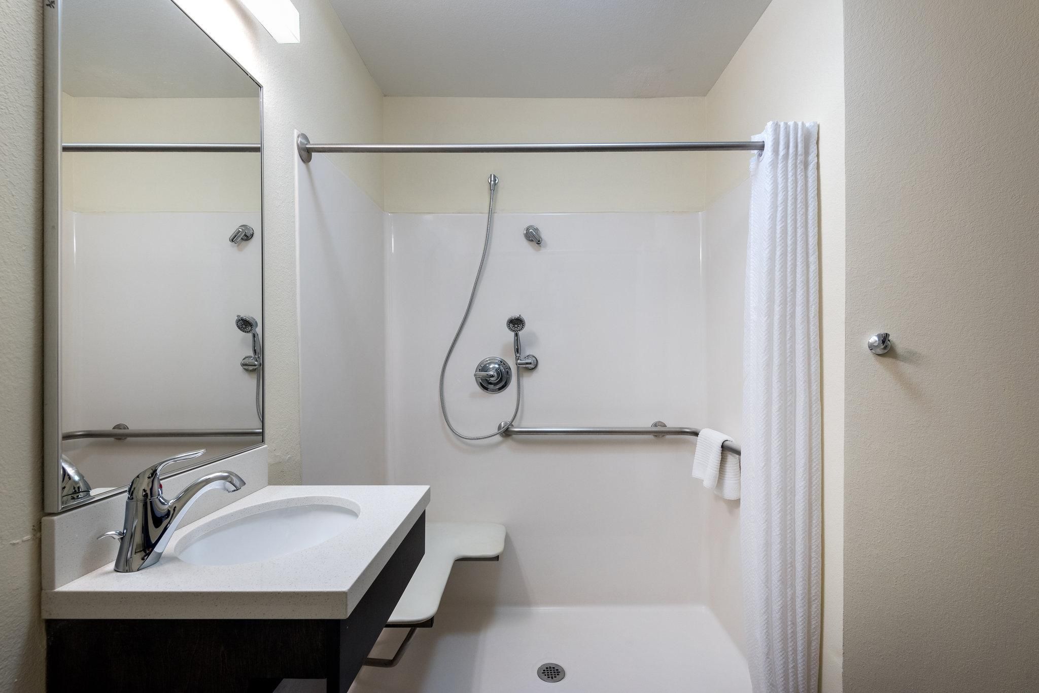 1 Queen 1 Bedroom Suite Mobility Accessible Roll Shower