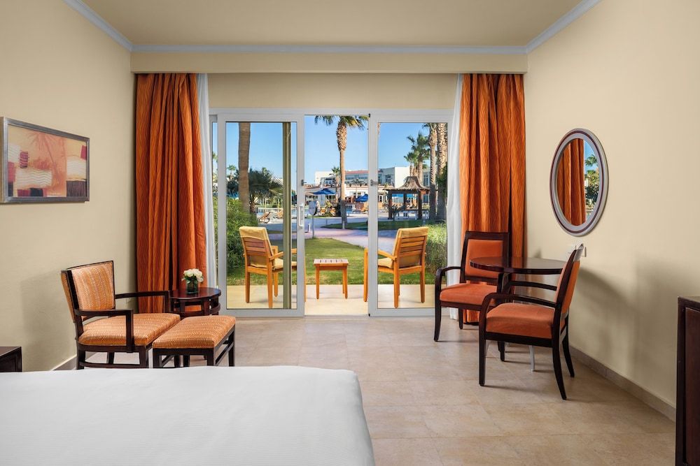DoubleTree by Hilton Sharm El Sheikh - Sharks Bay Resort deluxe room, king bed, pool view, mountainside 4