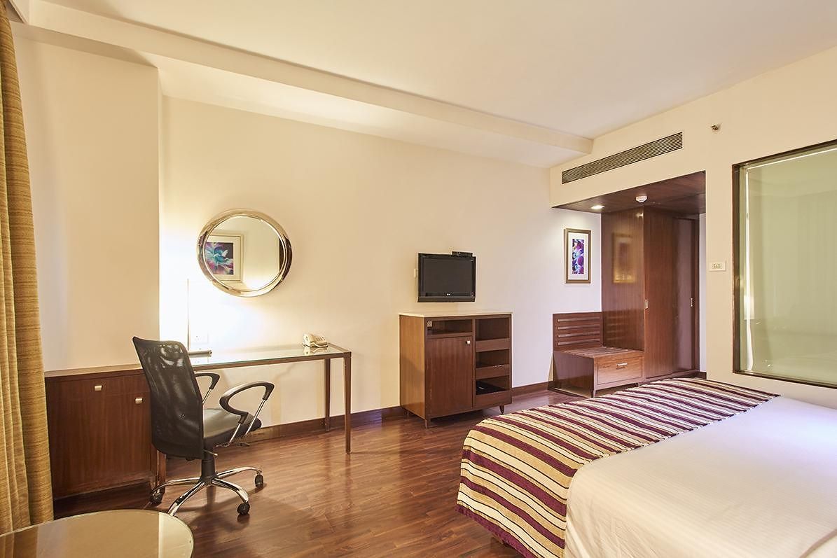 Royal Orchid Central, Pune Deluxe Room with Bathtub 11