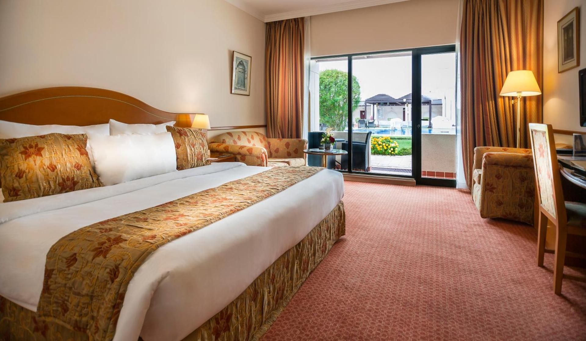 Golden Tulip Nizwa Hotel Standard Room - 1 King Bed 1 Sofa Bed Pool View 31SQM Free WiFi