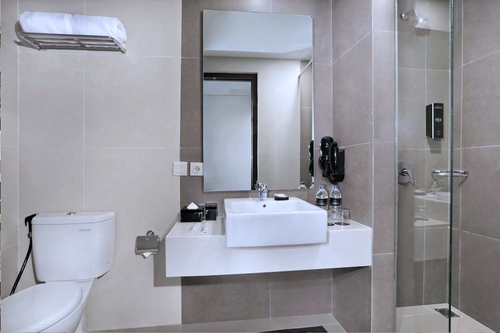 Hotel Neo Gajah Mada Pontianak by ASTON Deluxe Room 6