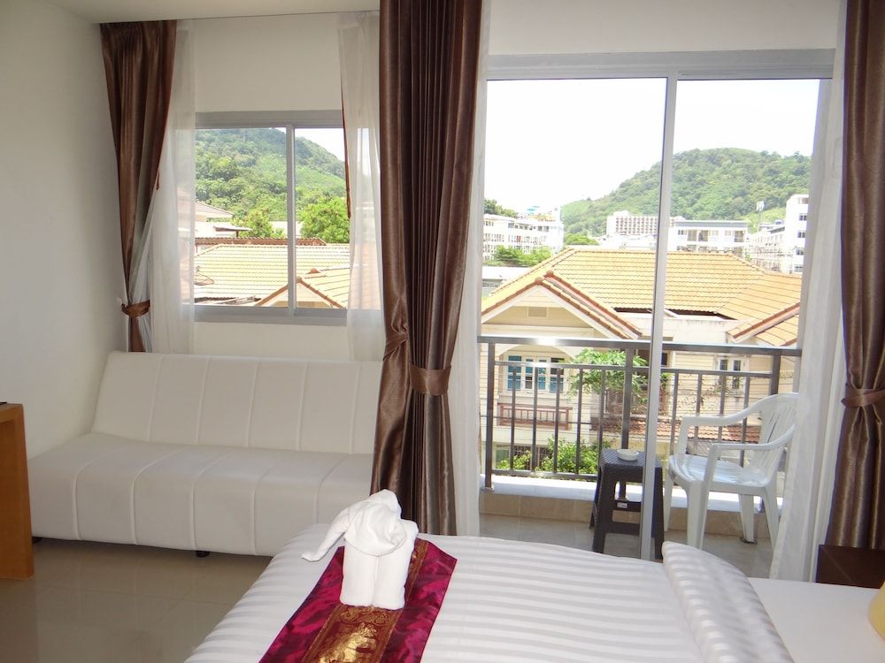 Tropical Sunset Hotel Patong Deluxe King Room with Balcony 6