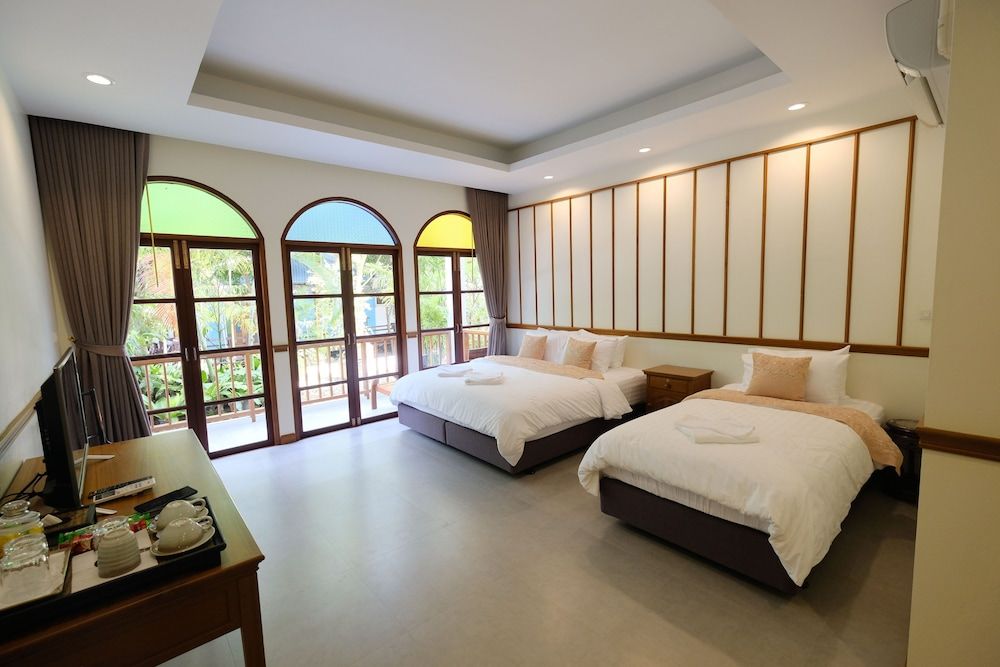 Baan Imm Sook Resort Deluxe Triple Room, 1 Bedroom, Balcony, Garden View 3
