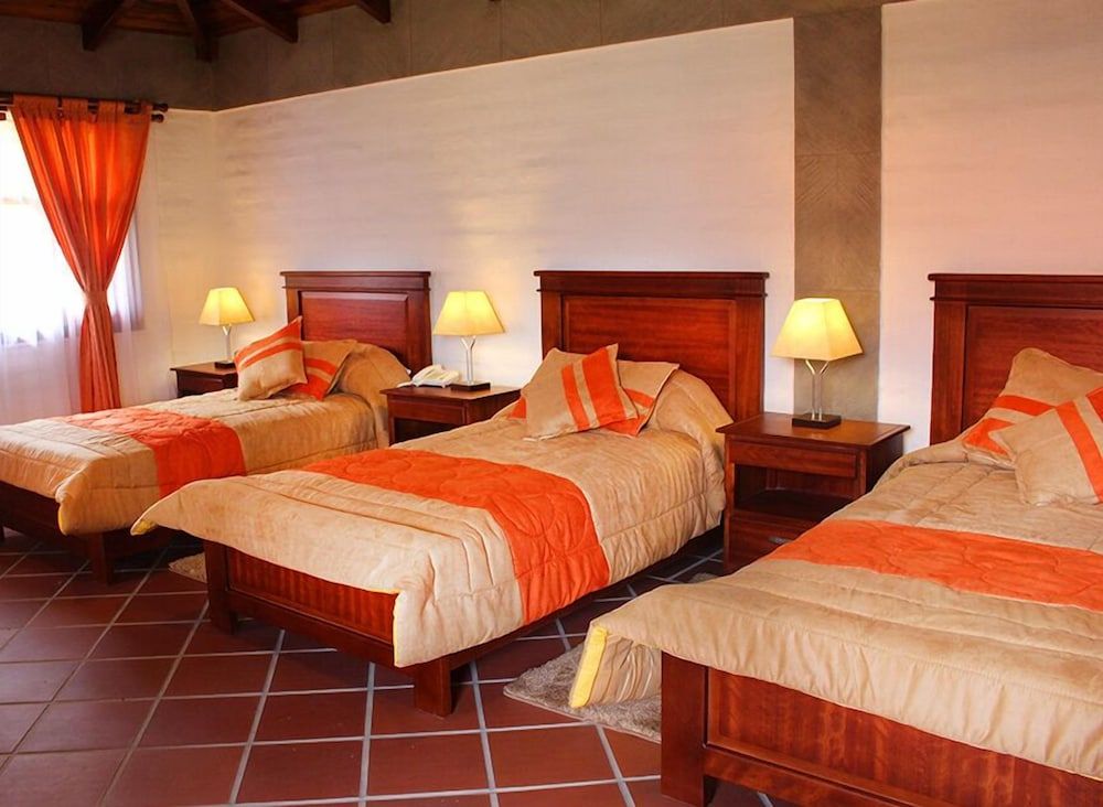 Hosteria Quinta San Clemente Comfort Triple Room, 3 Bedrooms, Pool Access, Courtyard View 2