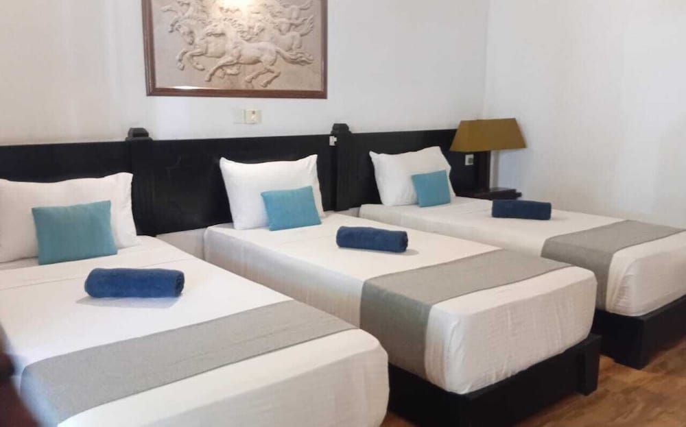 Deluxe Triple Room, Multiple Beds, Garden View