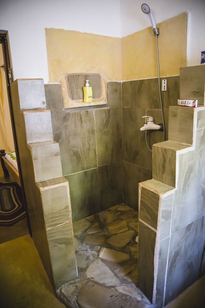 Moonshine Uroa Boutique Hotel Quadruple Room, Patio, Oceanfront 3