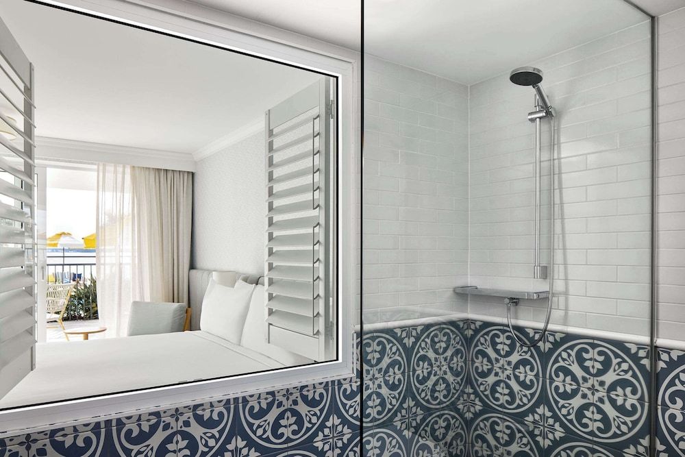 The Beachcomber Hotel & Resort, an Ascend Collection Resort Room, 1 King Bed, Poolside (Water View) 11