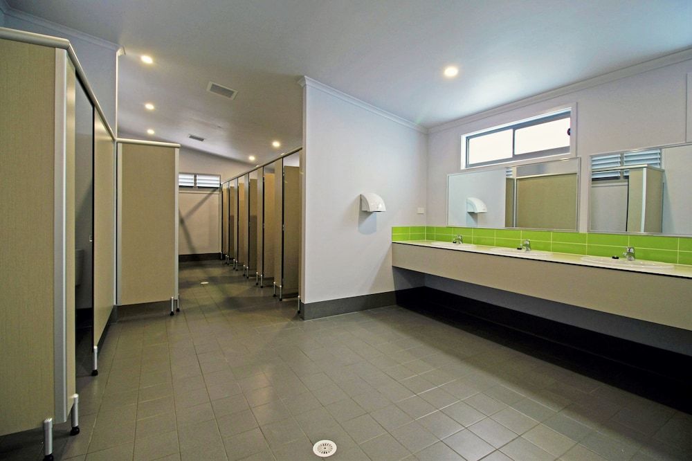 Standard Powered Slab Site - with Shared Bathroom. Bring your own Caravan or Tent