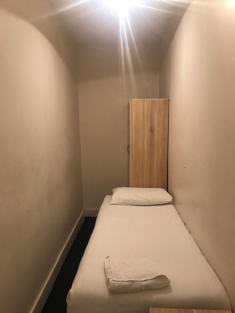 Basic Single Room, No Windows (Shared Bathroom)