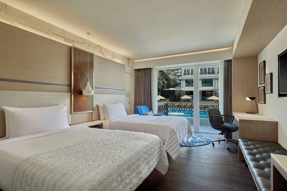 Classic Room with 2 Queen Beds and Pool View and Balcony