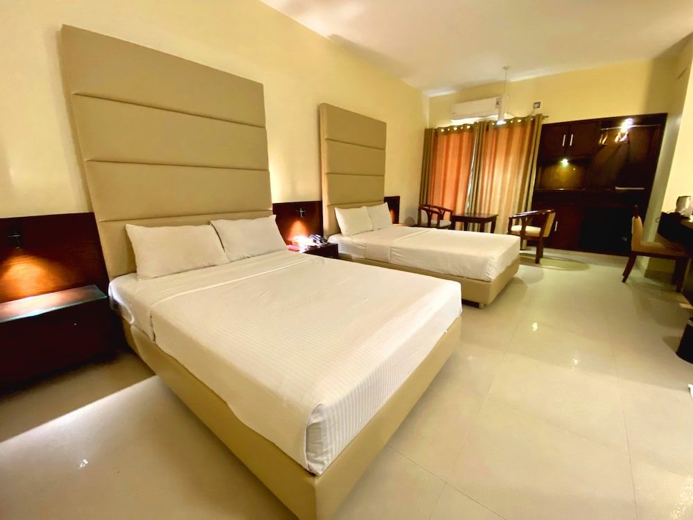 Nirvana Inn Deluxe Quadruple Room