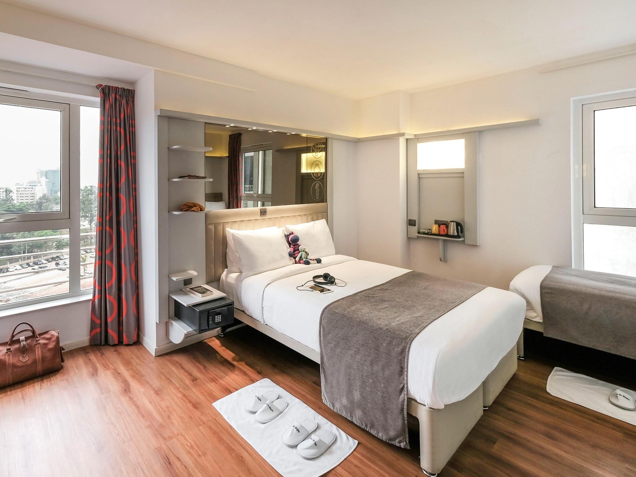 Trendy room with one double bed and one single bed