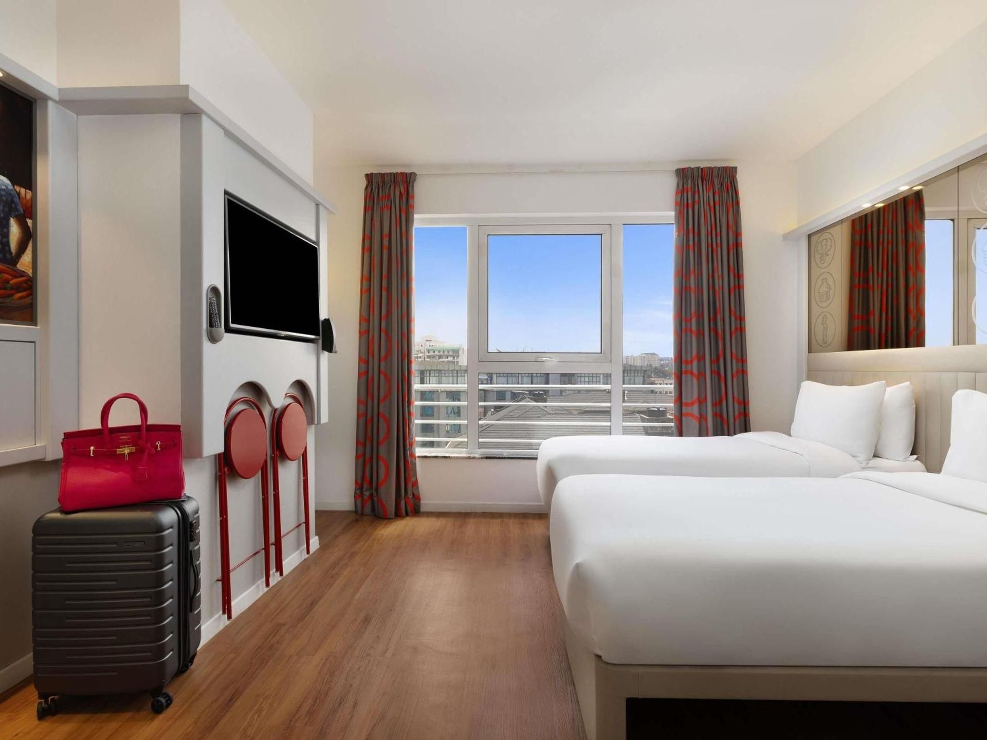 Trendy room with two single beds