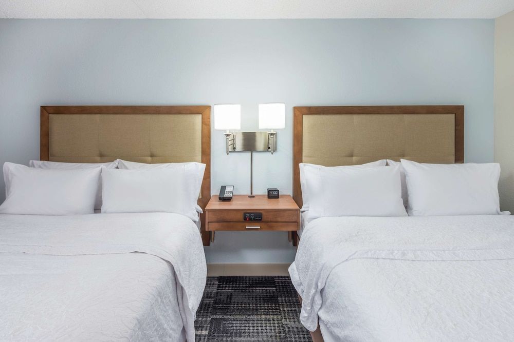Two queen size bed with a queen size sofa bed