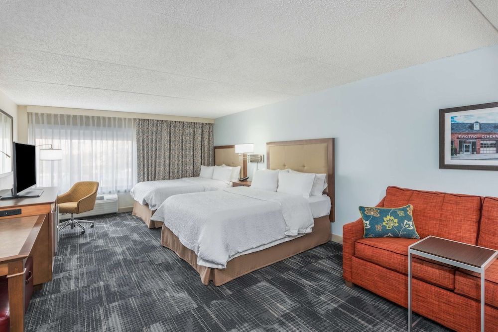 Two queen size bed with a queen size sofa bed