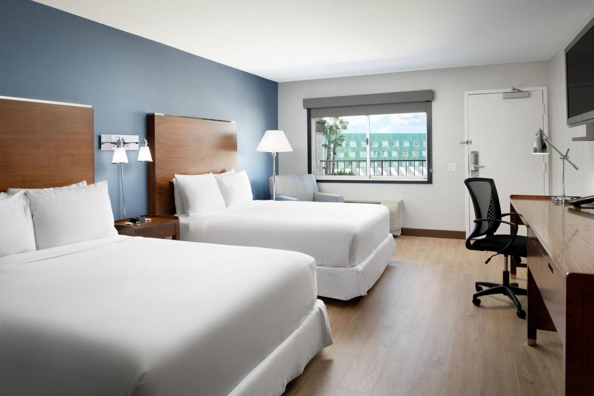 Queen Room with Two Queen Beds and Pool View - Hearing Accessible