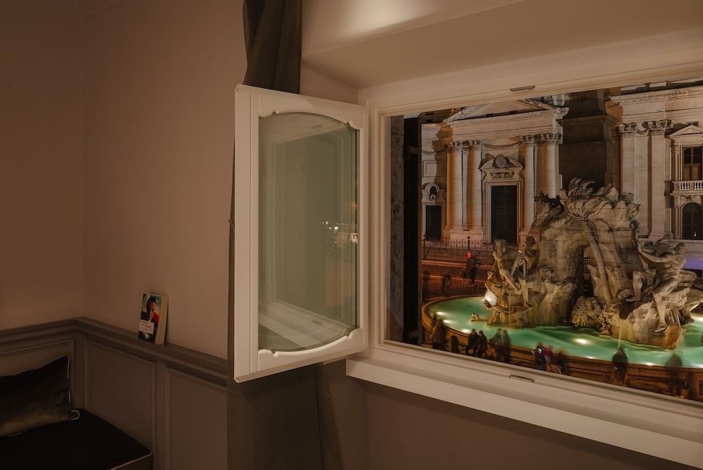 Rhea Silvia Luxury Navona Deluxe Triple Room, Fireplace