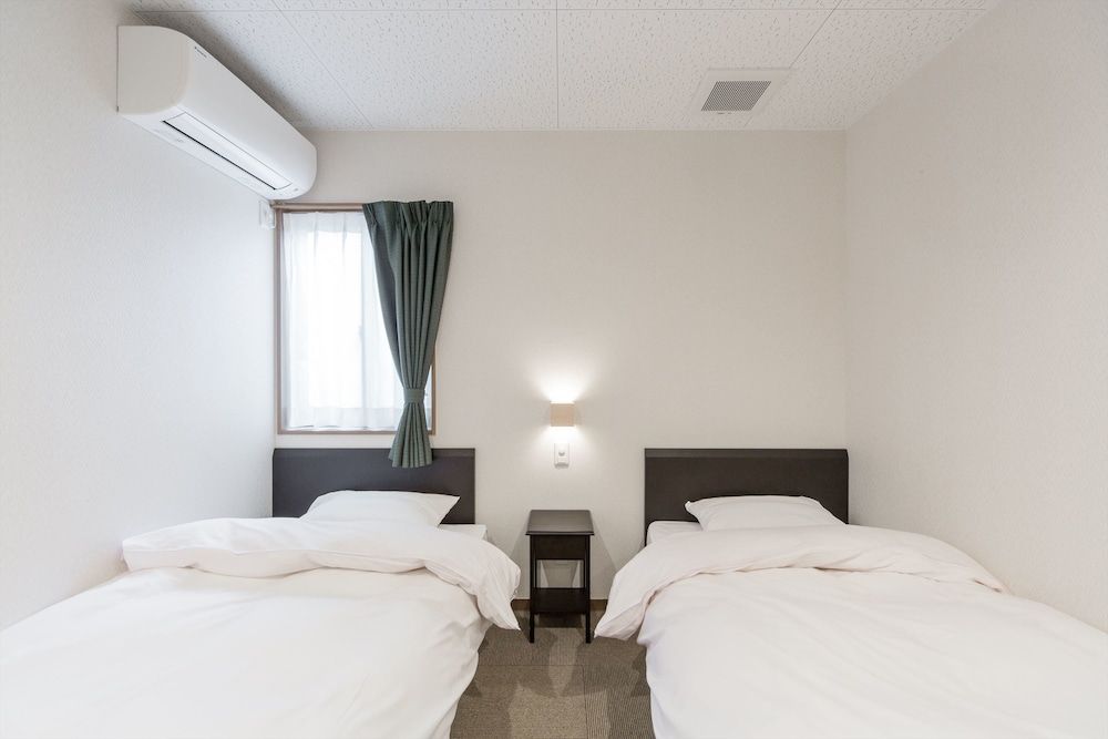 Twin Room (Up to 2 adults and 2 children)