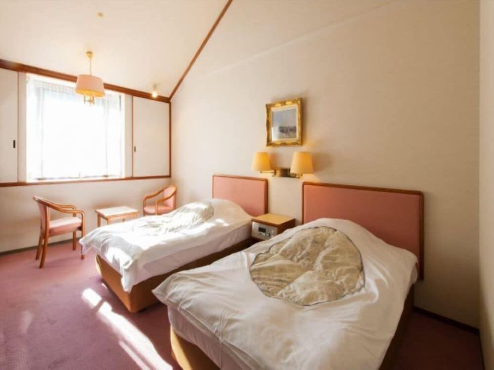Twin Room (Shared Bathroom)