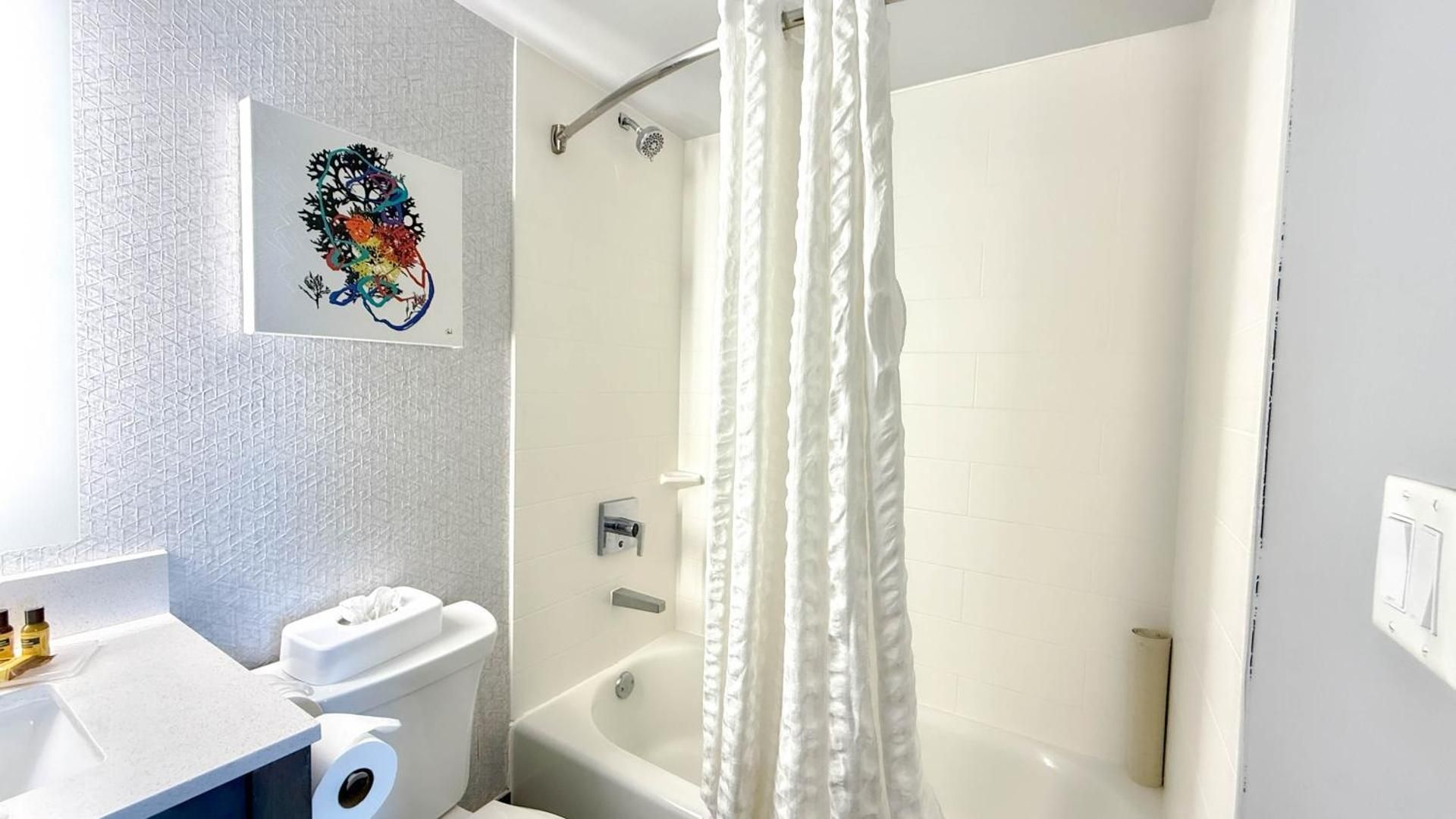 Two-Room Queen Suite with Two Queen Beds, Sofa Bed, Balcony, Partial Ocean View and Kitchenette - Non-Smoking