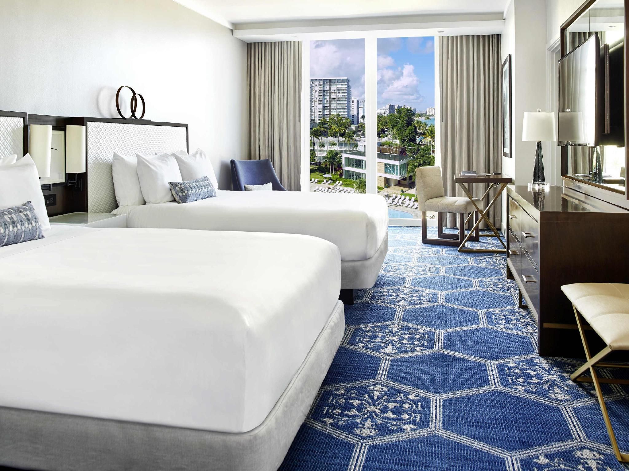DELUXE PARTIAL OCEAN VIEW 2 QUEEN. 445sf,41sm. Located in Grand Tower. Partial Ocean Views.