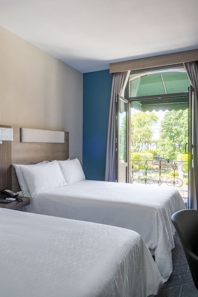 Standard Room, 2 Double Beds, Balcony, City View