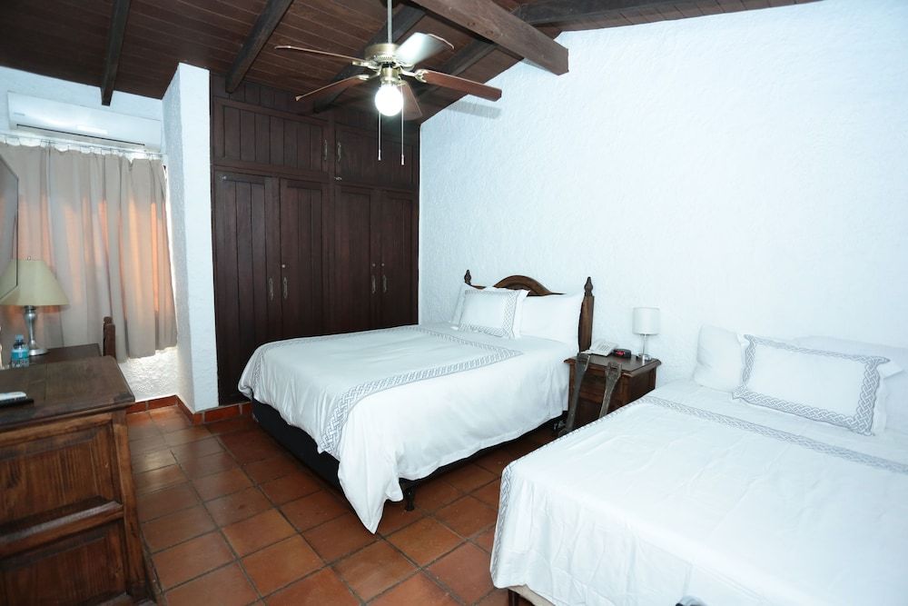 Deluxe Quadruple Room, 2 Queen Beds