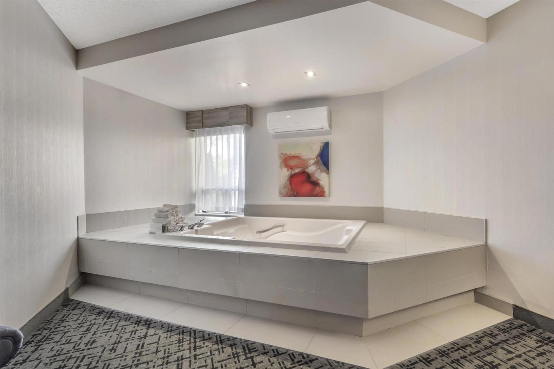 Suite - 1 King Bed, Nonsmoking, Kitchenette, Whirlpool, Sofabed