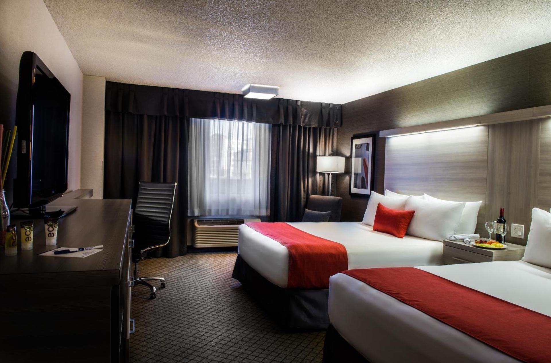 2 Queen Beds, Non-Smoking, Pet Friendly Room, Microwave And Refrigerator, In-Room Safe, Wi-Fi, Full