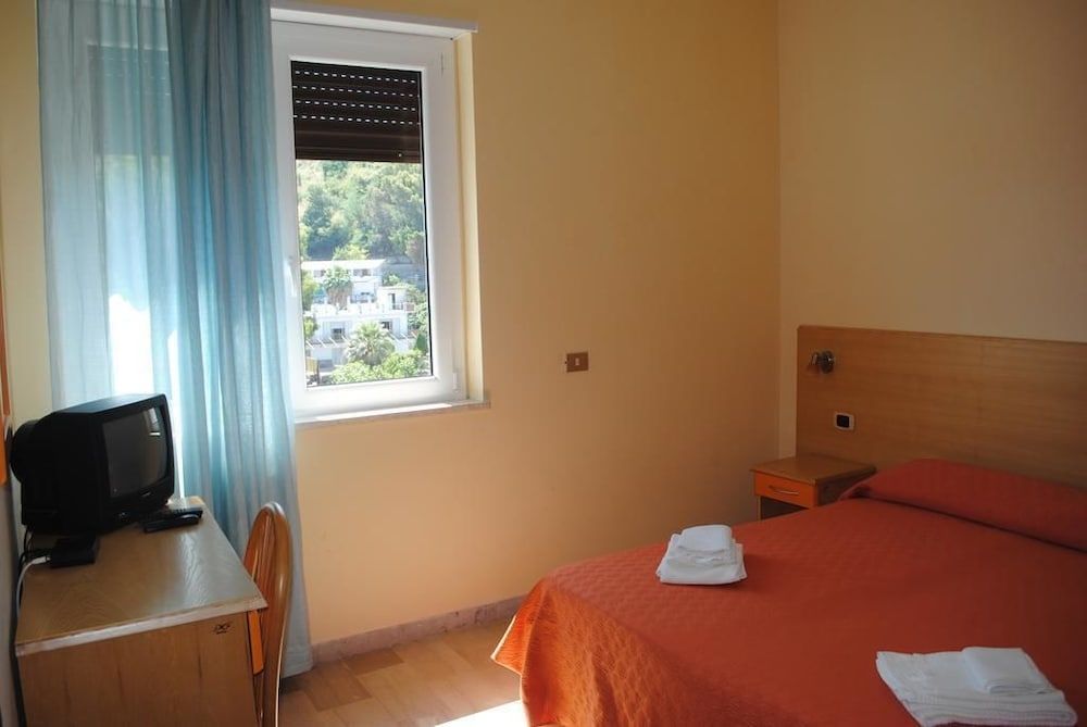 Economy Room Double or 2 single beds with internal view of the building .