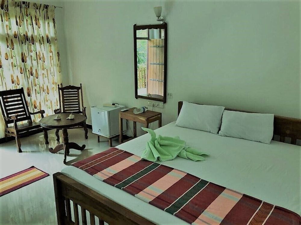 Turtle Paradise Deluxe Double Room, 1 King Bed, Balcony, Partial Sea View 9