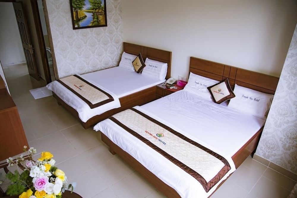 Huynh Duc Hotel Standard Quadruple Room, 2 Queen Beds 3