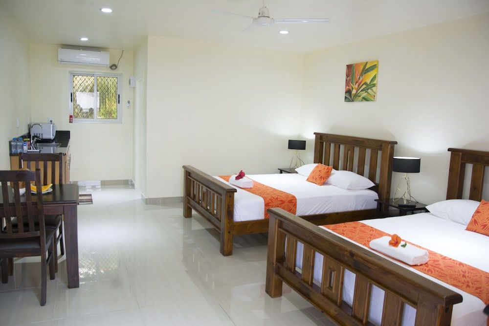 Samoana Boutique Hotel Deluxe Quadruple Room, 2 Queen Beds, Kitchen, Mountain View 5