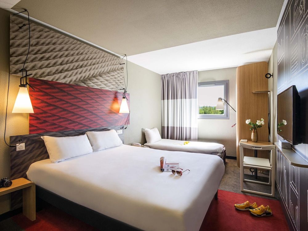 Chambre triple avec 1 lit double et 1 lit d'appoint