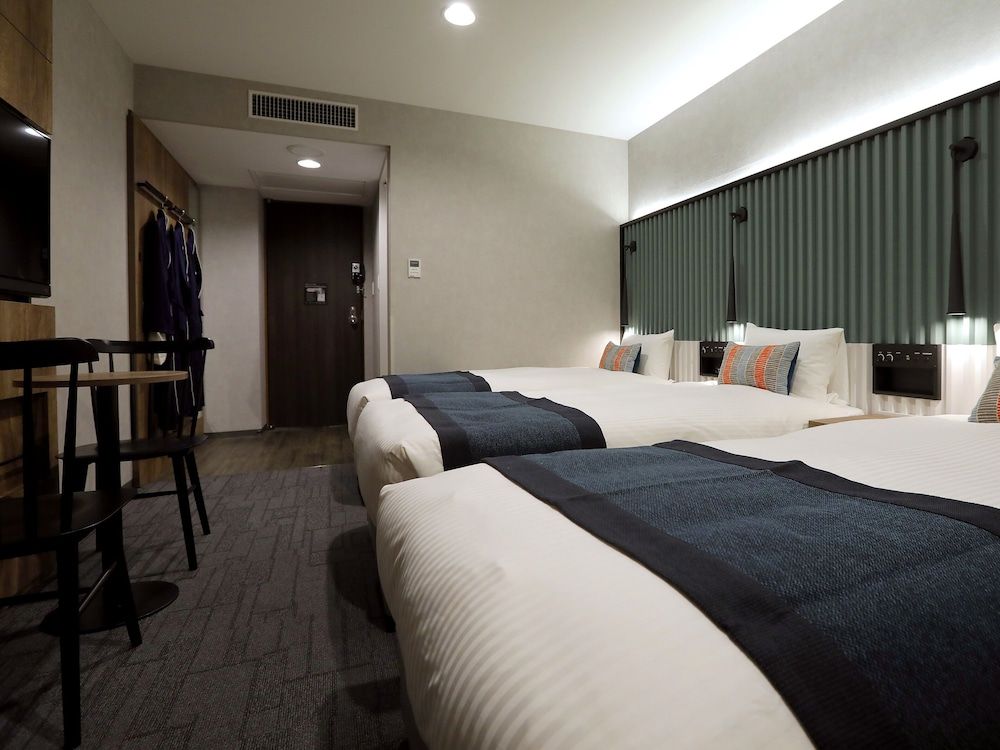 21 Sqm, Deluxe Triple Room (Bed Type: Single bed is arranged)