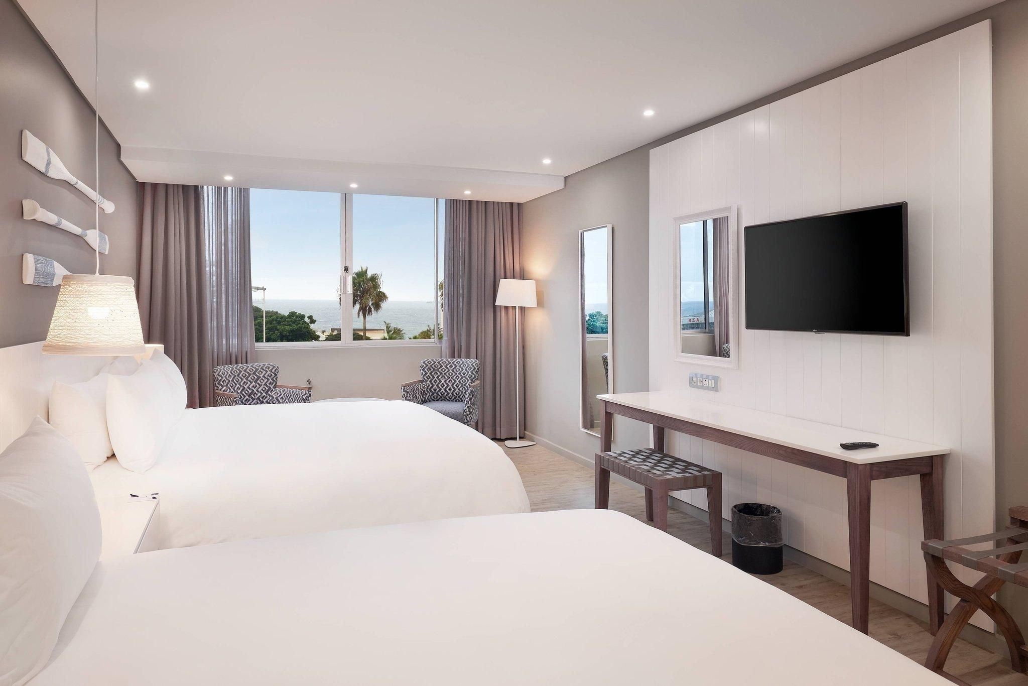 Guest room, 2 Queen, Partial ocean view
