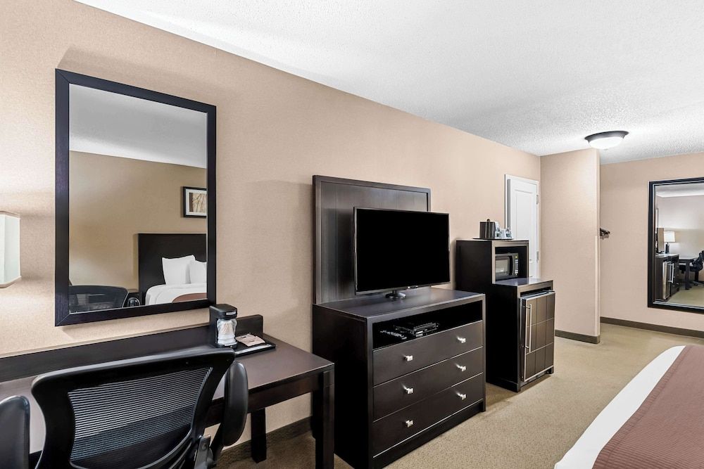 Heartland Inn & Suites, SureStay Collection by Best Western Standard Room, 1 King Bed, Refrigerator & Microwave, Courtyard Area 3