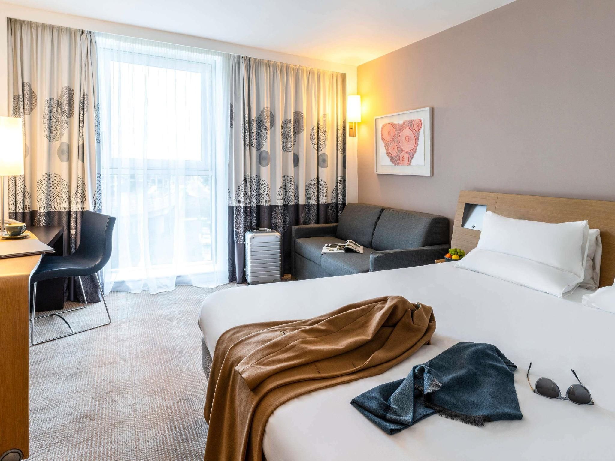 Superior Deluxe room with Queen bed and sofa
