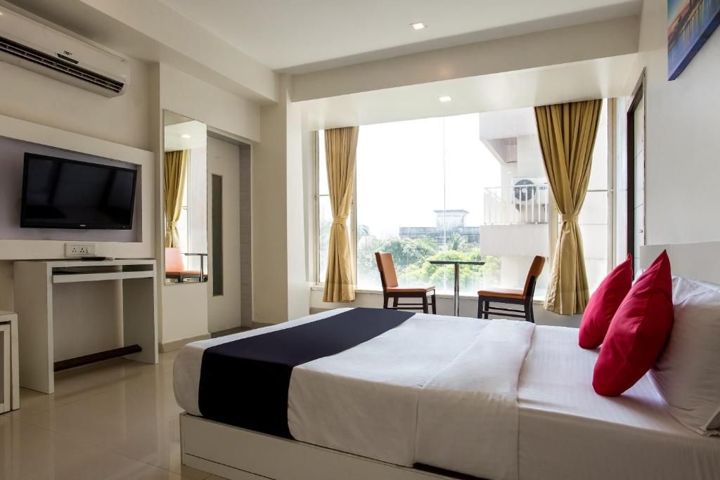 Capital O 35557 Hotel Aura Deluxe Room 10