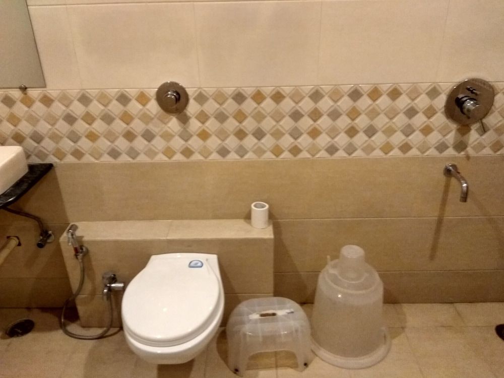 Capital O 75310 The Jk Hotel Deluxe Non AC room 7